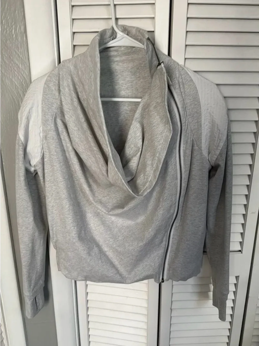 Lululemon Sway Moto Jacket in light gray and white.